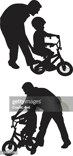 stockillustraties, clipart, cartoons en iconen met father playing with his child - fiets hoed