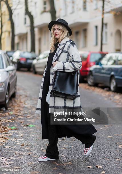 Marie Jaster wearing a black white checked plaid edited wool coat, and blouse, black h&m vest, a black utzon leather pants, red white checked vans...