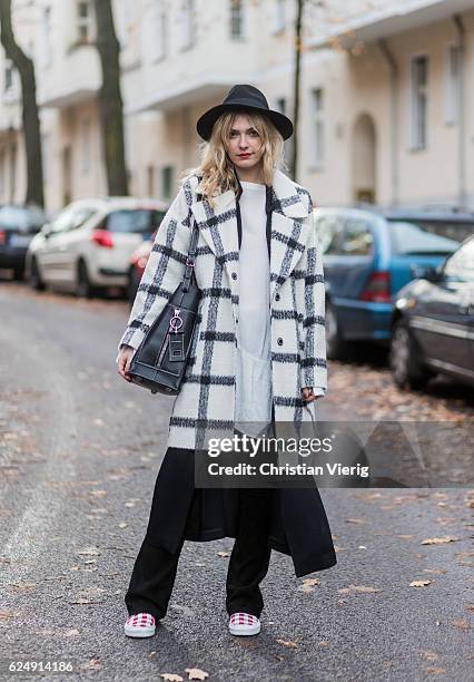 Marie Jaster wearing a black white checked plaid edited wool coat, and blouse, black h&m vest, a black utzon leather pants, red white checked vans...