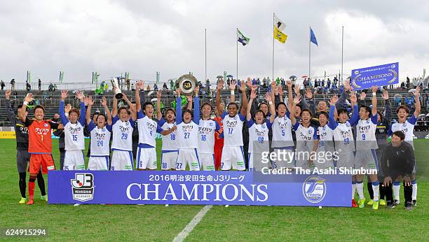 Oita Trinita players celebrate winning the third division title and promotion to the second division after the J.League third division match between...