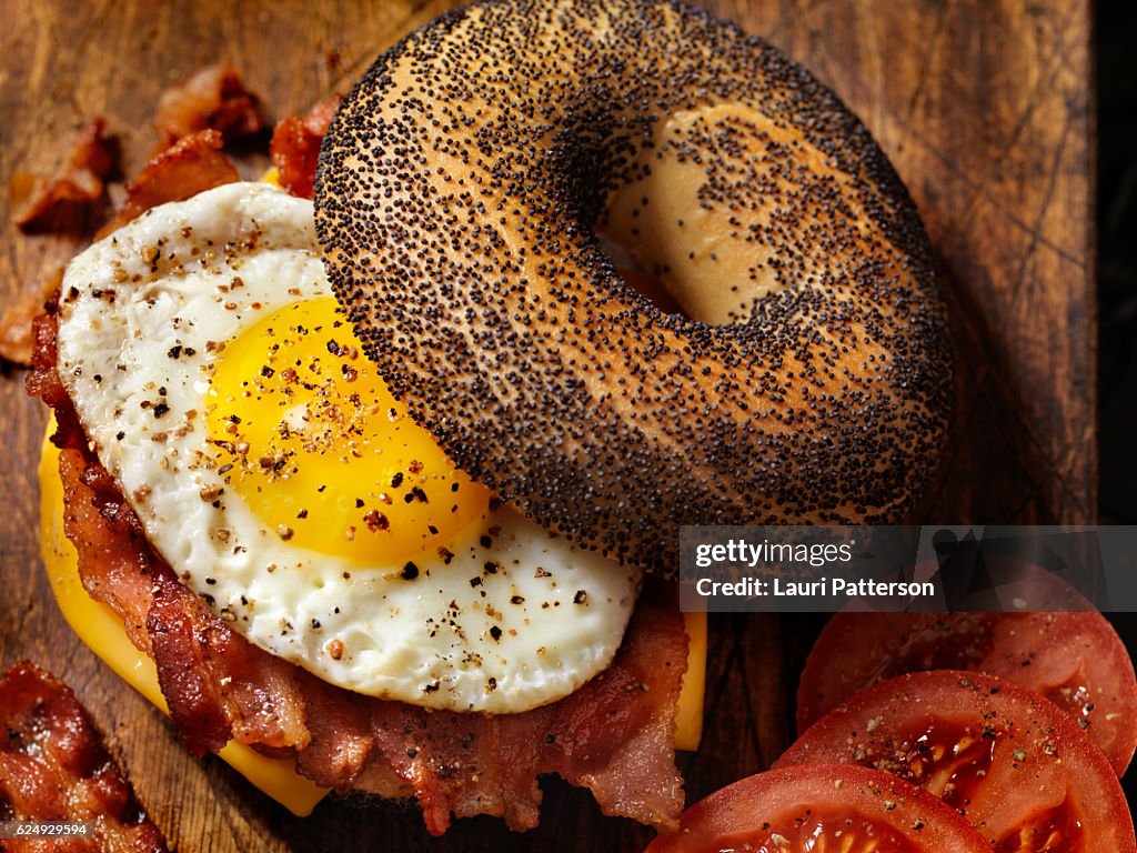 Poppyseed Bagel Sandwich with A Fried Egg, Bacon and Cheese