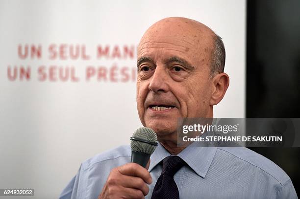 Candidate for the French right-wing presidential primary Alain Juppe delivers a speech at his campaign headquarters following the vote's first round,...