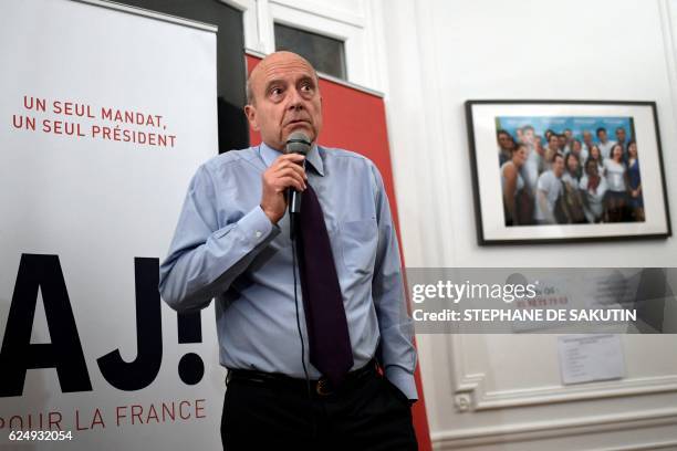 Candidate for the French right-wing presidential primary Alain Juppe delivers a speech at his campaign headquarters following the vote's first round,...