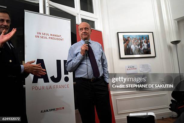 Candidate for the French right-wing presidential primary Alain Juppe delivers a speech at his campaign headquarters following the vote's first round,...