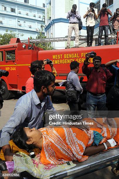 Victims shifted to the hospital after a massive fire broke out in state-run SSKM Hospital on November 21, 2016 in Kolkata, India. The fire was...