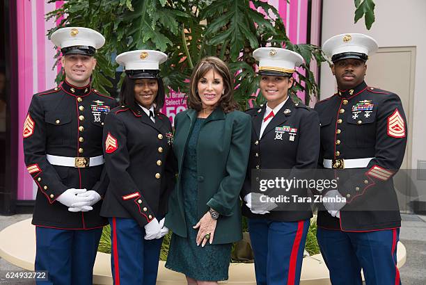 Actress Kate Linder and Marines representing Toys For Tots Foundation attend a press conference for the 85th Annual Hollywood Christmas Parade at...