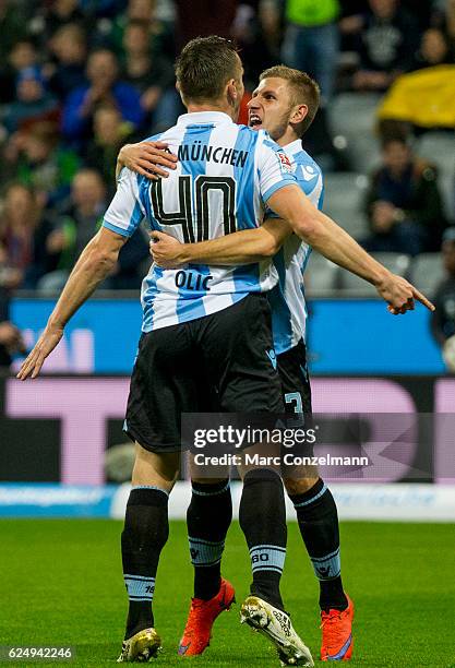 Ivica Olic and Levent Aycicek of TSV 1860 Muenchen celebrate the opening goal during the Second Bundesliga match between TSV 1860 Muenchen and 1. FC...