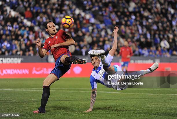 Luciano da Rocha Neves of CD Leganes shoots past Unai Garcia of CA Osasuna during the La Liga match between CD Leganes and CA Osasuna at Estadio...