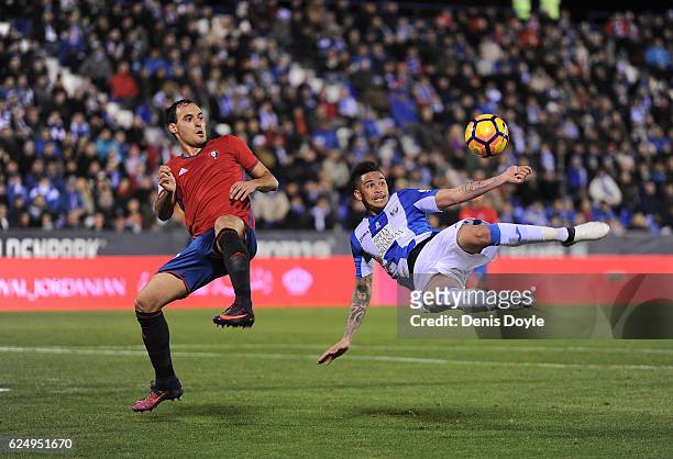 Luciano da Rocha Neves of CD Leganes shoots past Unai Garcia of CA Osasuna during the La Liga match between CD Leganes and CA Osasuna at Estadio...
