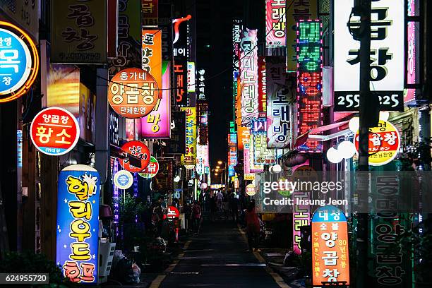 neon signs in busan nampo-dong street - busan fotografías e imágenes de stock