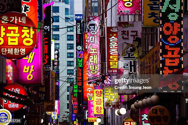 neon signs in busan nampo-dong street - korean language stock pictures, royalty-free photos & images