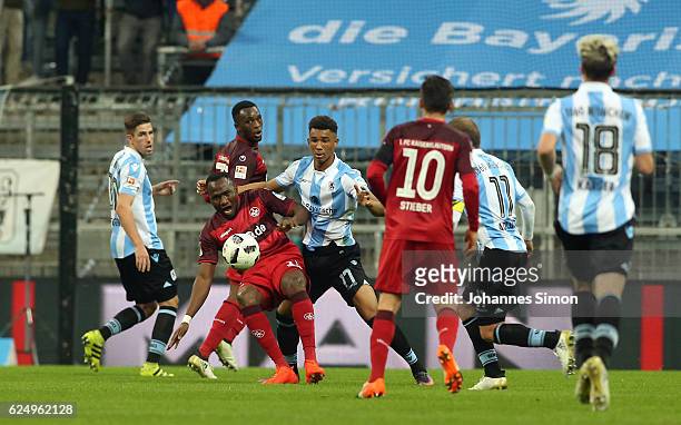 Felix Uduokhai of Muenchen fights for the ball with Jacques Zoua of Kaiserslautern during the Second Bundesliga match between TSV 1860 Muenchen and...