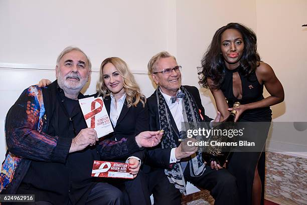 Udo Walz, Katherine Mehrling, Rene Koch and a model attend the Artists Against Aids Gala at Stage Theater des Westens on November 16, 2016 in Berlin,...