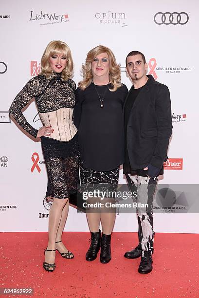 Biggy van Blond, Ades Zabel and a guest attend the Artists Against Aids Gala at Stage Theater des Westens on November 16, 2016 in Berlin, Germany.