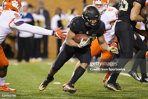 Wake Forest running back Matt Colburn evades a tackle by Clemson lineman Austin Bryant during the second half between the Clemson Tigers and the Wake...