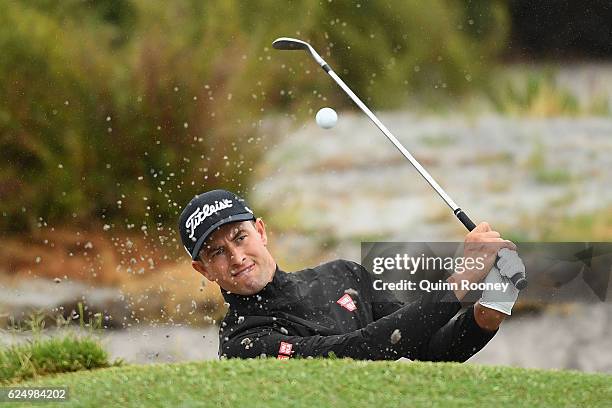 Adam Scott of Australia plays out of the bunker ahead of the 2016 World Cup of Golf at Kingston Heath Golf Club on November 22, 2016 in Melbourne,...