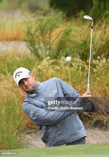 Marc Leishman of Australia plays out of the bunker ahead of the 2016 World Cup of Golf at Kingston Heath Golf Club on November 22, 2016 in Melbourne,...