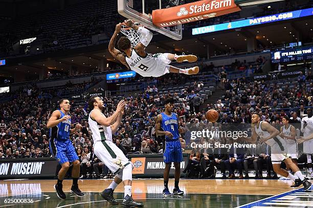 Michael Beasley of the Milwaukee Bucks dunks against the Orlando Magic during the first half of a game at BMO Harris Bradley Center on November 21,...