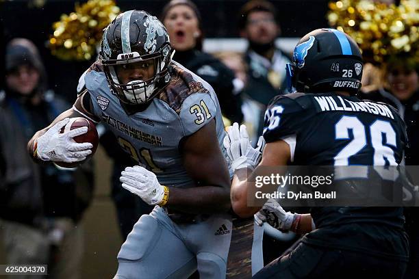 Jarvion Franklin of the Western Michigan Broncos runs with the ball against Ryan Williamson of the Buffalo Bulls in the second quarter at Waldo Field...