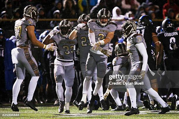 The Western Michigan Broncos celebrate after making a play in the third quarter against the Buffalo Bulls at Waldo Field on November 19, 2016 in...