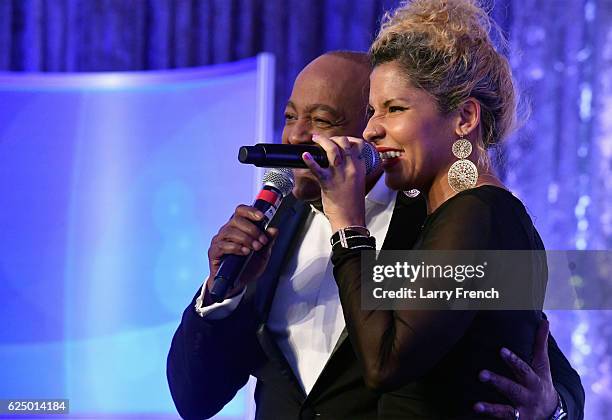 Peabo Bryson and Jaymee Rodriguez perform onstage during the Thurgood Marshall College Fund 28th Annual Awards Gala at Washington Hilton on November...