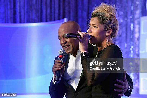 Peabo Bryson and Jaymee Rodriguez perform onstage during the Thurgood Marshall College Fund 28th Annual Awards Gala at Washington Hilton on November...