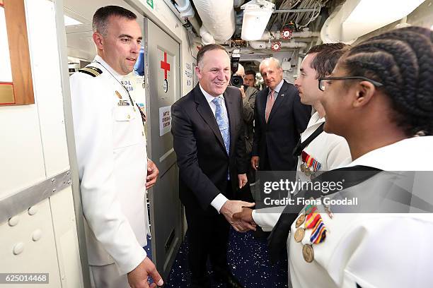New Zealand Prime Minister John Key with the ship's Captain, Commander Tim LaBenz thanks the crew of the USS Sampson at Devonport Naval Base on...