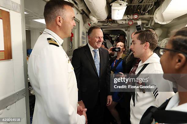 New Zealand Prime Minister John Key with the ship's Captain, Commander Tim LaBenz thanks the crew of the USS Sampson at Devonport Naval Base on...