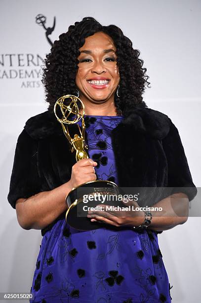 Shonda Rhimes pose with the "Founders" award in the press room during the 44th International Emmy Awards at New York Hilton on November 21, 2016 in...