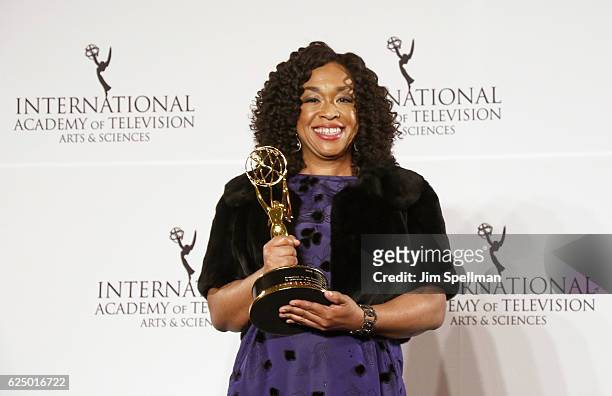 Shonda Rhimes pose with the 'Founders' award in the press room during the 44th International Emmy Awards at New York Hilton on November 21, 2016 in...