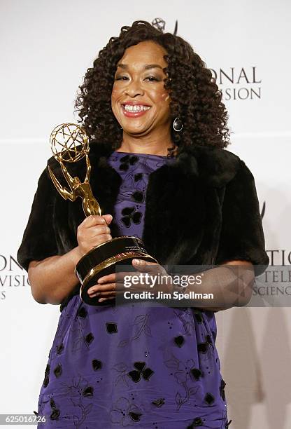 Shonda Rhimes pose with the 'Founders' award in the press room during the 44th International Emmy Awards at New York Hilton on November 21, 2016 in...