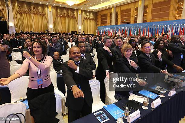 Guests do exercise during meetings break of the 9th Global Conference on Health Promotion at Shanghai International Convention Center on November 21,...