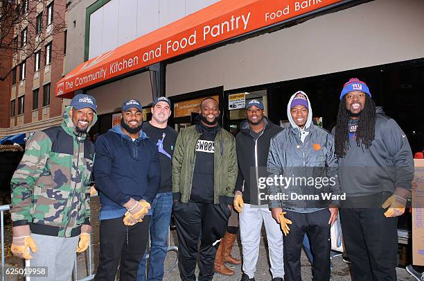 Tavares King, Landon Collins, Zak DeOssie, Owa Odighdizuwa, Will Johnson, Coty Sensabaum and Adam Gettis appear to serve at Food Bank for New York...