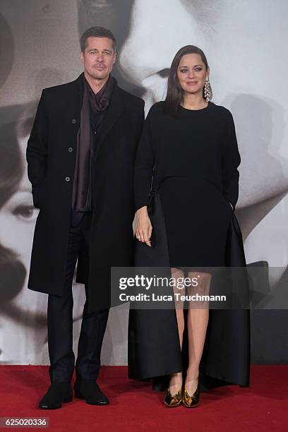 Marion Cotillard and Brad Pitt attend the UK Premiere of "Allied" at Odeon Leicester Square on November 21, 2016 in London, England.