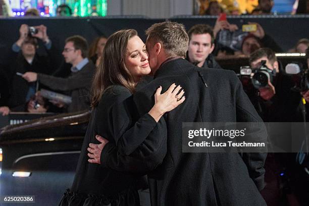 Marion Cotillard and Brad Pitt attend the UK Premiere of "Allied" at Odeon Leicester Square on November 21, 2016 in London, England.