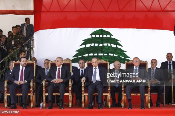 Lebanese President Michel Aoun , Parliament Speaker Nabih Berri , Caretaker Prime Minister Tamam Salam and new Prime Minister Saad Hariri sit during...