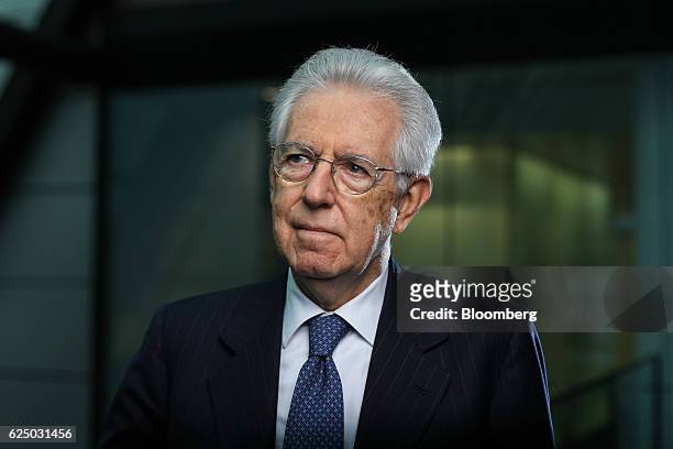 Mario Monti, Italy's former prime minister, poses for a photograph following a Bloomberg Television interview in London, U.K., on Tuesday, Nov. 22,...