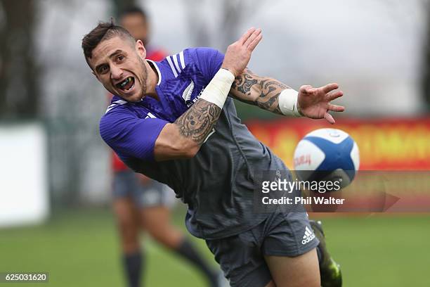 Perenara of the New Zealand All Blacks passes during training at the Suresnes Rugby Club on November 22, 2016 in Paris, France.
