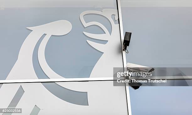 Berlin, Germany A surveillance camera hangs next to the coat of arms of the Federal Republic of Germany, an eagle, on a building on November 22, 2016...