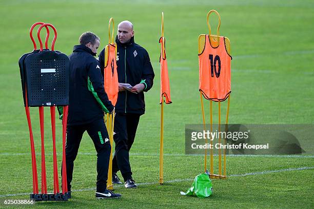 Assistnt coach Frank Geideck and head coach Andre Schubert attend taining session ahead of the UEFA Champions League match between Borussia...