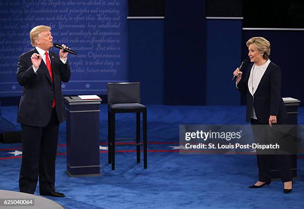 Donald Trump and and Hillary Clinton on stage during the second debate between the Republican and Democratic presidential candidates on Sunday, Oct....