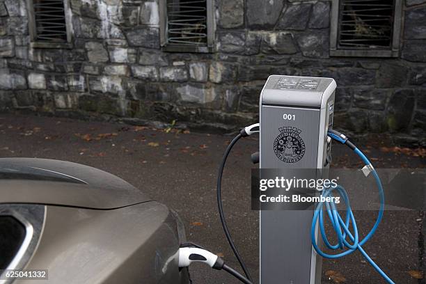 Charging plugs connects an electric vehicle to a charging station at Kongens gate near Akershus festning in Oslo, Norway, on Monday, Nov. 21, 2016....