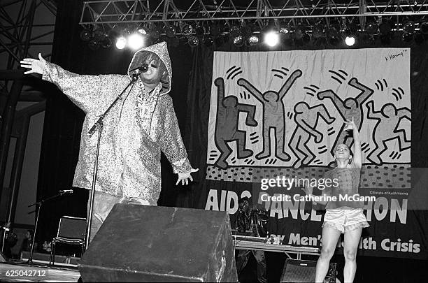 Prince Be of PM Dawn performs before a Keith Haring banner at AIDS Dance-a-Thon on November 30th, 1991 at Rosalind Ballroom in New York City, New...