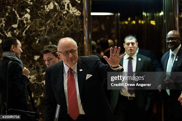 Former New York City mayor Rudy Giuliani waves as he leaves Trump Tower, November 22, 2016 in New York City. President-elect Donald Trump and his...