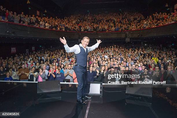 Humorist Dany Boon acknowledges the applause of the audience at the end of his "Dany De Boon Des Hauts-De-France" Show at L'Olympia on November 11,...