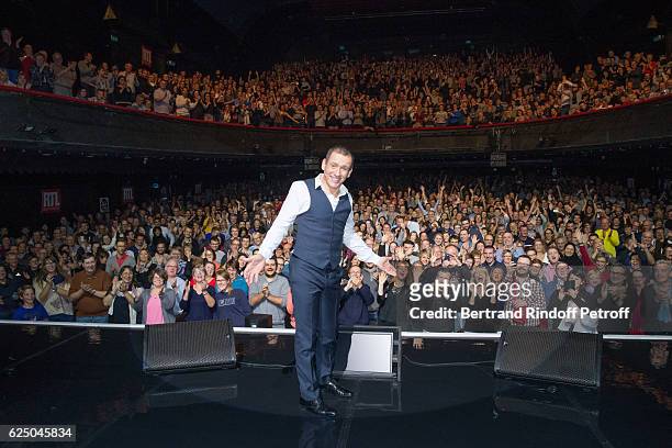 Humorist Dany Boon acknowledges the applause of the audience at the end of his "Dany De Boon Des Hauts-De-France" Show at L'Olympia on November 11,...