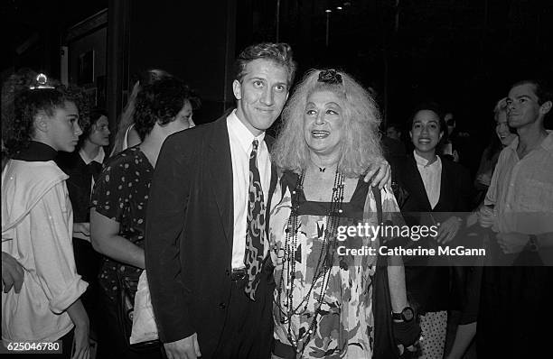 Mark Kostabi and Sylvia Miles pose for a photo at a party for the premiere of David Lynch's film "Wild at Heart" on August 9th, 1990 in New York...