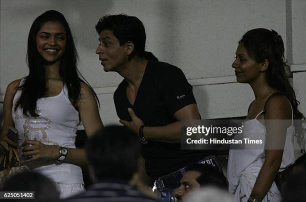 Twenty20 Cricket - India vs Australia - Shahrukh Khan with his wife Gauri Khan and actress Deepika Padukone during the first T20 match between India...