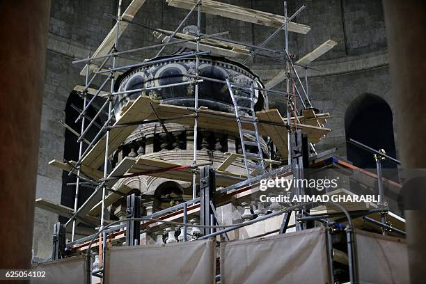 Picture taken on November 22, 2016 at the Church of the Holy Sepulchre in Jerusalems Old City shows the Edicule surrounding the Tomb of Jesus being...