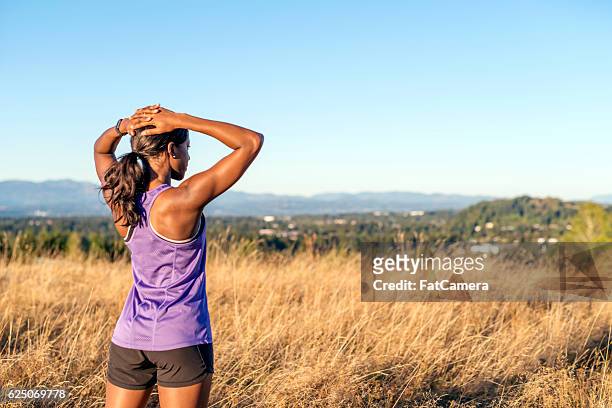 african american adult female with hands on her head - forward athlete stock pictures, royalty-free photos & images